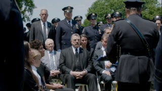 The Reagans listen to a eulogy on Blue Bloods Season 14 Episode 18